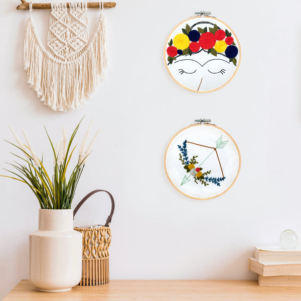 Load image into Gallery viewer, Floral Bow and Arrow Embroidery Pattern Hoop Art Displayed as Wall Art

