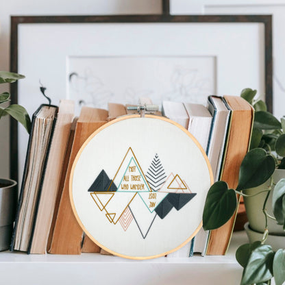 Wanderlust Mountain Embroidery Hoop Art Displayed on a Shelf