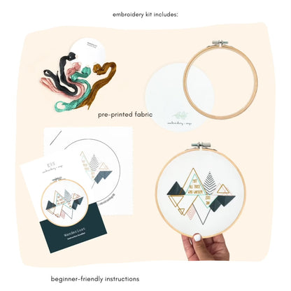 wanderlust embroidery kit with dmc threads, felt backing , 6" bamboo hoop, embroidery needle, pre-printed fabric, and beginner-friendly instructions